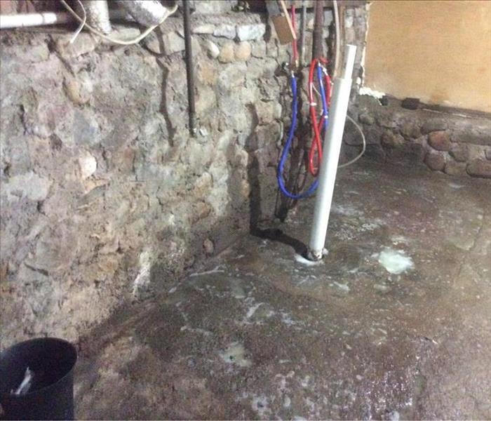 Basement with concrete floor and support pole